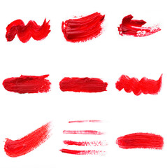 Red colored brush stroke paiting over isolated background, canvas watercolor texture, red lipstick smudge