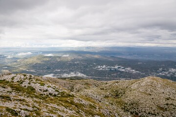 Fototapeta na wymiar Mountain Biokovo. Mountain landscape with low clouds. Croatia