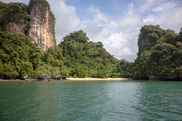 Fototapeta na wymiar Green sea and big green mountains. Beautiful nature landscape. Andaman Sea, Krabi Thailand