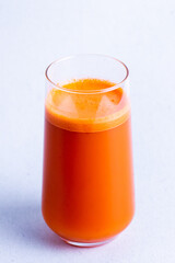 Fresh healthy apple juice in glass on a white background.