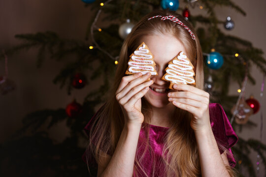 girl holding christmas gingerbread in hands