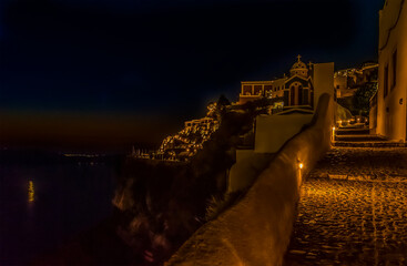 A long exposure view of the path leading out of the town of Fira, Santorini at night in summertime