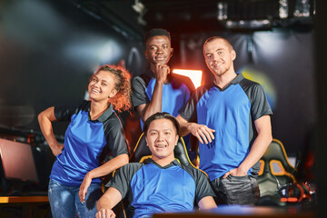 Happy multiracial cybersport team smiling at camera after eSport tournament. Online video games competition © Friends Stock