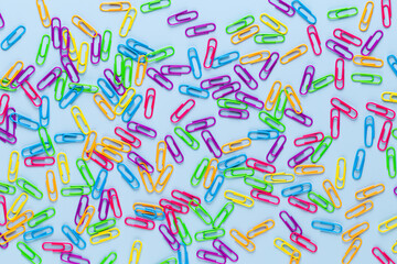 Paper color clip notebook on blue background. Flat lay.