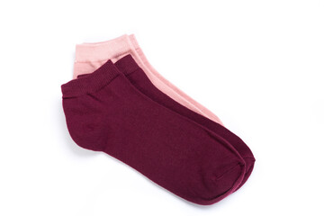 two pairs of colored short socks on a white background, top view