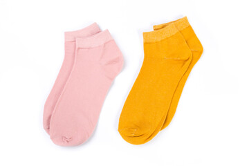 two pairs of colored short socks on a white background, top view