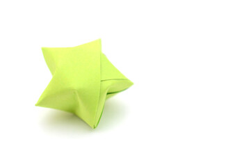 Origami lucky star on white