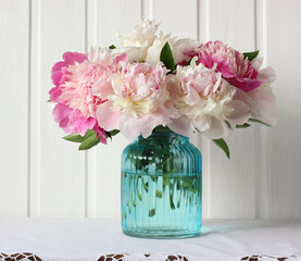 peonies. flowers in a glass vase.