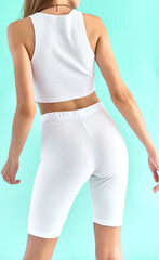Girl wears white tight fabric shorts. Comfort sport clothes template