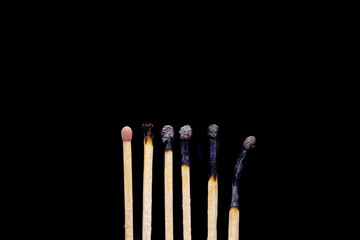 Matchsticks extinguished isolated on black background
