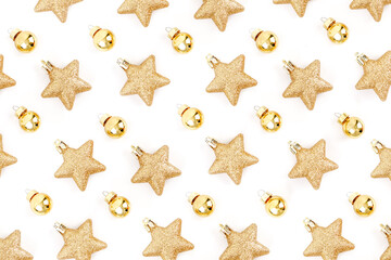 Fototapeta na wymiar Top view of minimal golden and yellow Christmas elements pattern, stars glitter and ball on white background for make creative design and paper print gift wrapping.