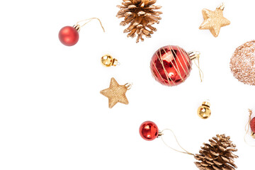 Top view of Christmas elements , pine cone, red ball, ribbon, stars glitter, gold ball, bells on white background with copy space.