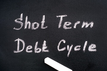 Obraz premium Blackboard with words Short Term Debt Cycle and chalk.