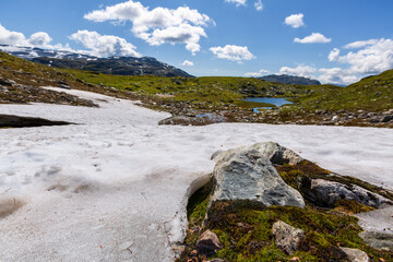 Landscape with snow on foreground in summertime in Norway