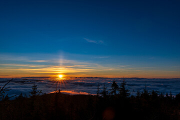 Inversion in the valley during sunrise with mountain ridge in the background, Beskydy , Czech Republic.