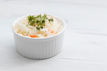 sauerkraut in a salad bowl on the table, the right traditional food