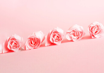 Festive concept from rosebuds on pink background. Valentines Day or Flowers in Motion.