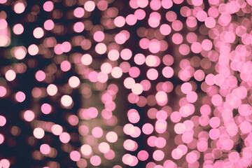 Abstract background with pink blurred lights. Bokeh effect. Festive colors. Christmas celebration concept.