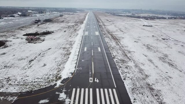 abandoned icy runway at the old airfield. airport in winter. crisis in aviation.
