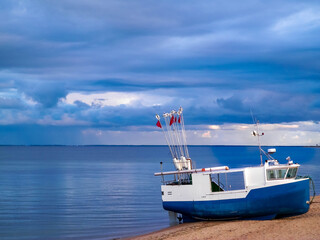Naklejka premium Fishing boat on a Baltic Sea coast in Mechelinki, Poland.
