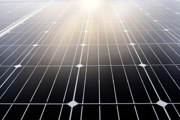 Close-up of solar panels under the blue sky illuminated directly by the sun. Solar energy and sustainable energy concept
