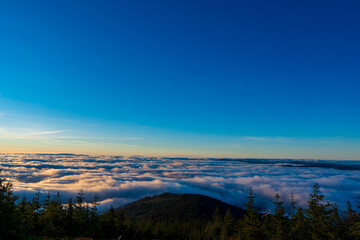 Inversion in the valley during sunrise with mountain ridge in the background, Beskydy , Czech Republic.