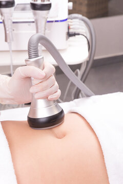 Woman getting vacuum massage procedure in beauty salon