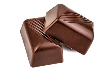two chocolate candies on white