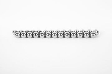 Stainless steel shiny metal iron ball bearings isolated on white background