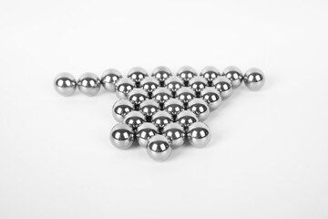 Stainless steel shiny metal iron ball bearings isolated on white background