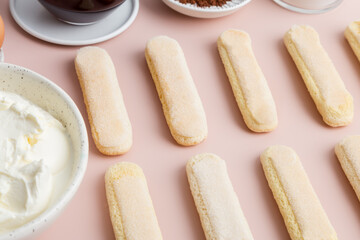 Ingredient for recipe of tiramisu. Savoiardi at pink minimal background