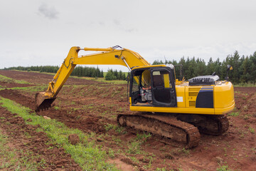 Crawler Excavator digging bucket on construction of road. Construction of a road. Earth movement