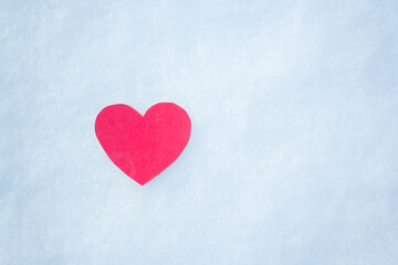 paper red heart on snow with snowflakes. Love winter. Valentine day, mother day, woman day. Copy space.