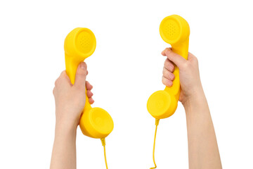 Yellow handset in woman hand isolated on white.