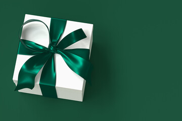 white gift box 3d with green ribbon and bow on green background