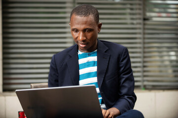 handsome young businessman working on the laptop