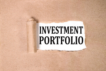INVESTMENT PORTFOLIO, text on white paper on torn paper background