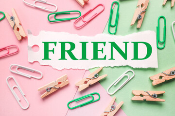 FRIEND, text on white paper on colored background