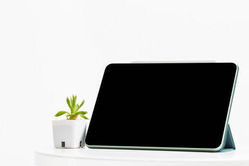 Modern device the tablet on isolated light background
