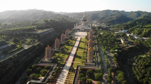 Aerial drone sunset view of Fo Guang Shan Buddha Museum in Kaohsiung, Taiwan.
Low angle, traveling and tilt movements, HD.