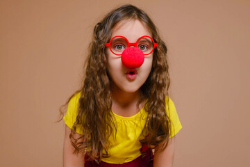 Funny girl in a clown costume. 1 April fool's day. Raffle.