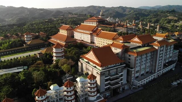Aerial drone sunset view of Fo Guang Shan Buddha Museum in Kaohsiung, Taiwan.
Mid angle, parallax movement, HD.