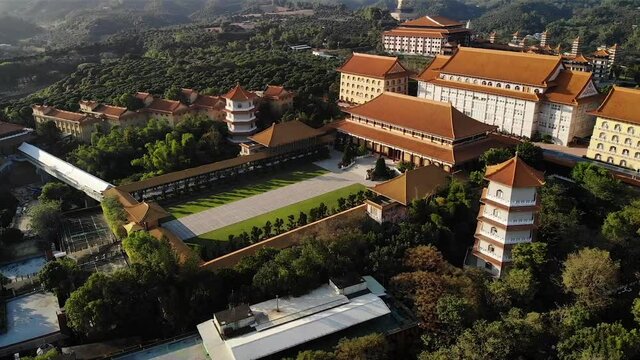 Aerial drone sunset view of Fo Guang Shan Buddha Museum in Kaohsiung, Taiwan.
Low angle, parallax movement, HD.