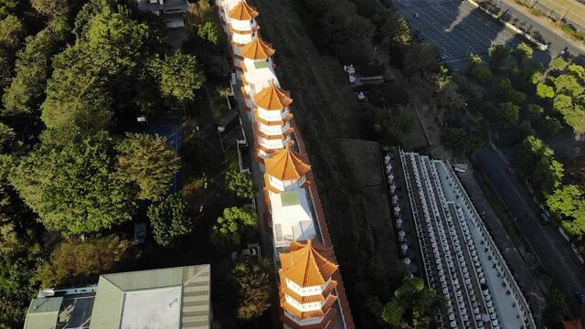 Aerial drone sunset view of Fo Guang Shan Buddha Museum in Kaohsiung, Taiwan.
Low angle, traveling and tilt movements, HD.