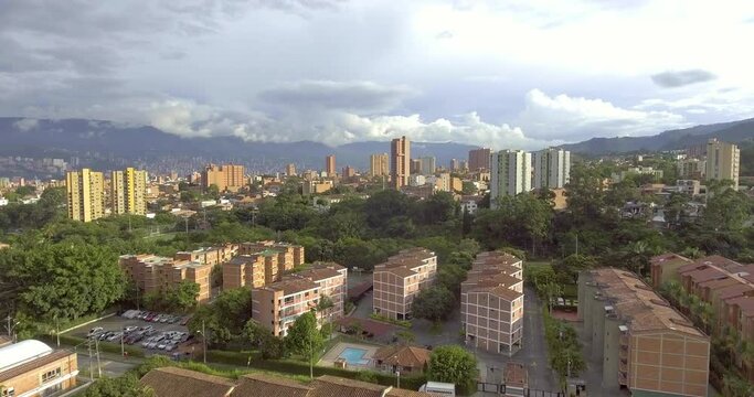 Beautiful Medell&iacute;n, Antioquia, Colombia Cityscape with Houses, Buildings, Towers and Lots of Trees on a Cloudy Day