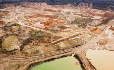 Top view of sand quarry mining with pond