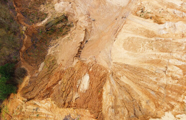 Top view of sand quarry mining with pond