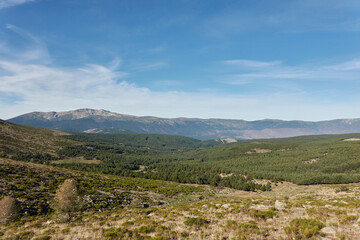 Fototapeta na wymiar Panoramic views of the Sierra de Guadarrama National Park from the Cuerda Larga path. Madrid's community. Spain