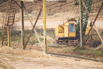 Fototapeta na wymiar Industrial architecture and technology for mining in a sand quarry