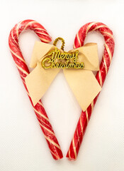 Christmas heart and ribbon. Christmas candy canes and ribbon with text "Merry Christmas".
